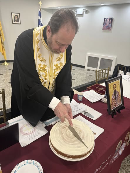 Father Chrysostom cuts the vasilopita